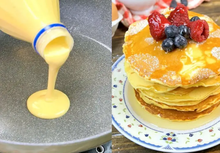 Impasto per pancake versato da una bottiglia su una padella, accanto a una pila di pancake guarniti con frutti di bosco e sciroppo.