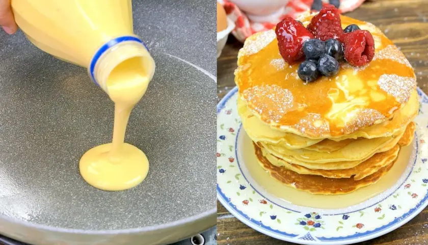Impasto per pancake versato da una bottiglia su una padella, accanto a una pila di pancake guarniti con frutti di bosco e sciroppo.